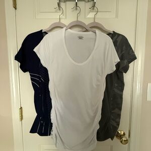 Three!!! Athleta brand momentum tees. Worn once. Very good almost new condition